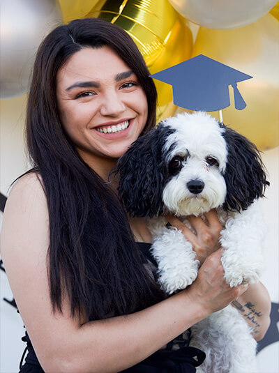 Genesis Osuna with dog graduating