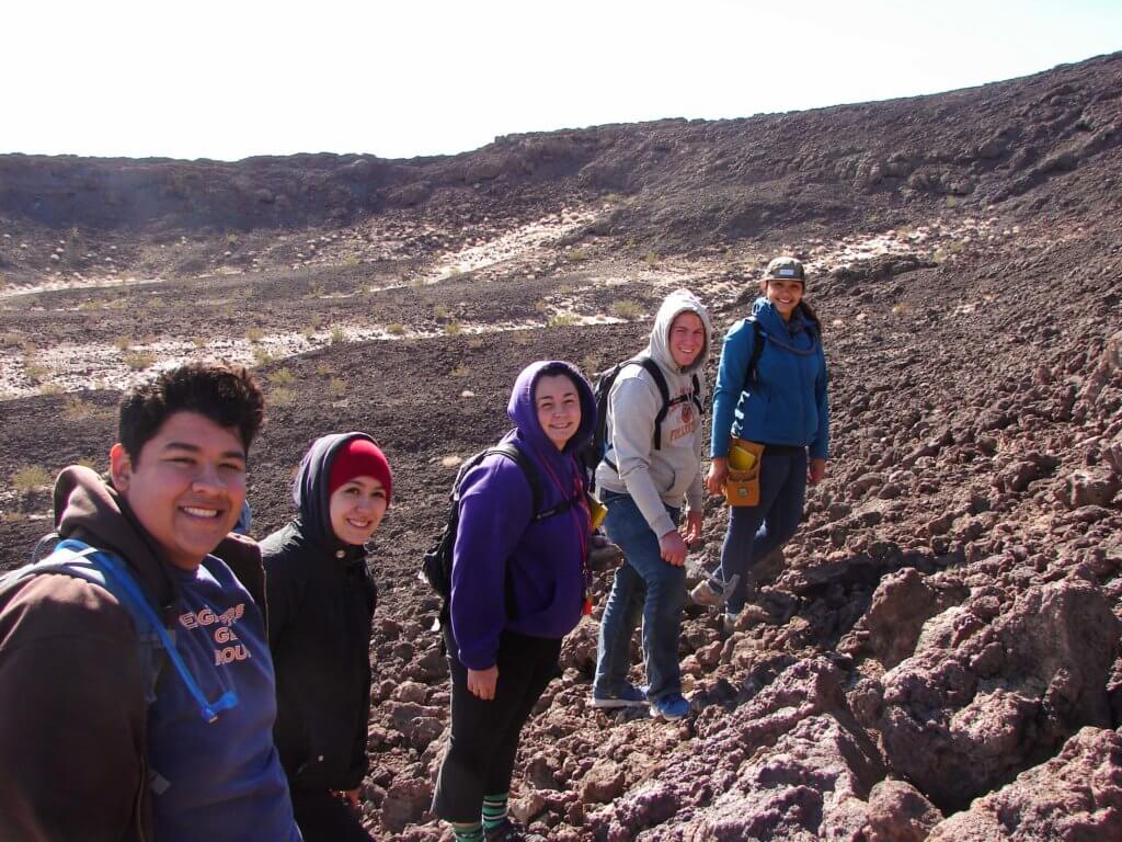 Geology Students Sampling Basalt in field