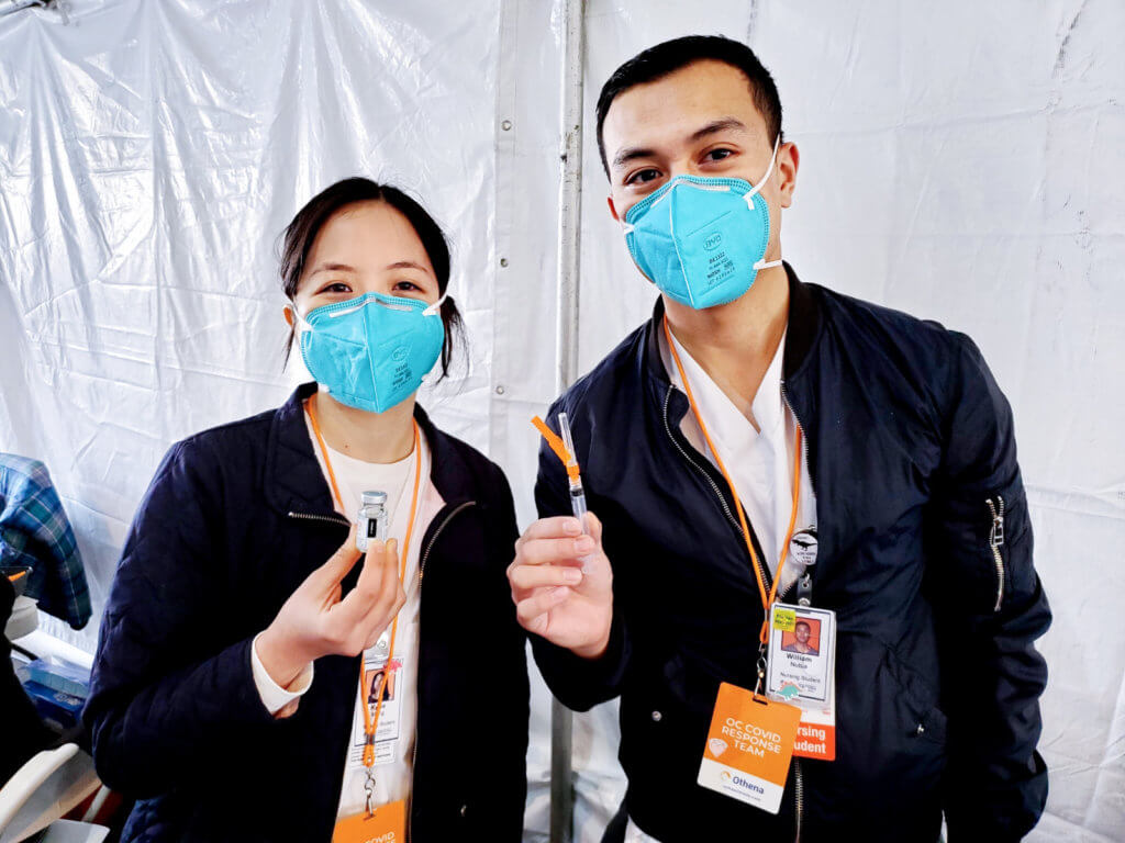 Kylee Meng and William Nubla, CSUF nursing students with vaccines