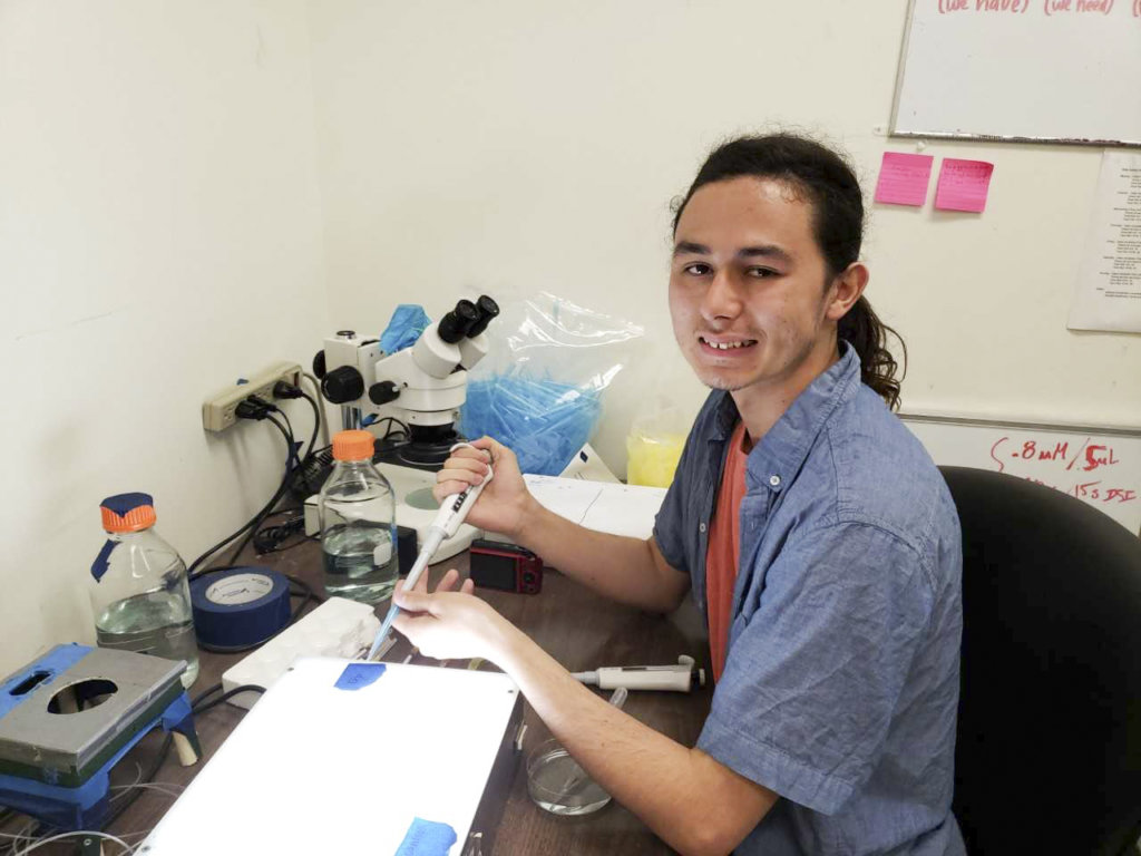 Trevor Zimmerman Thompson working in lab