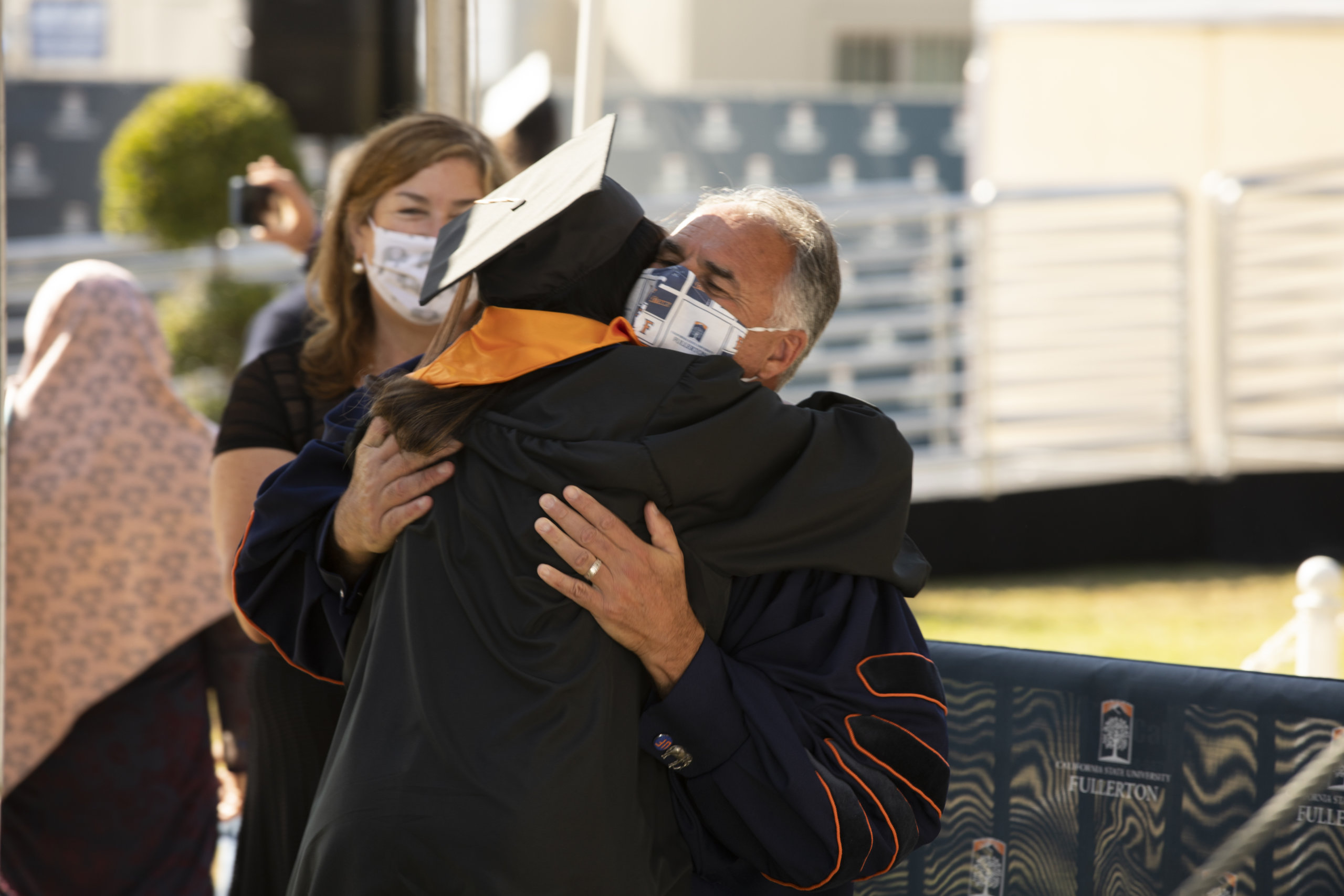 President Virjee hugs Asha