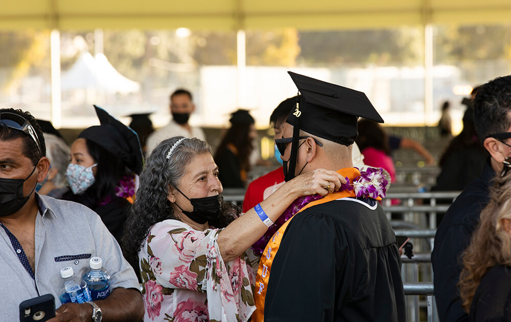 mother fixes graduates regalia