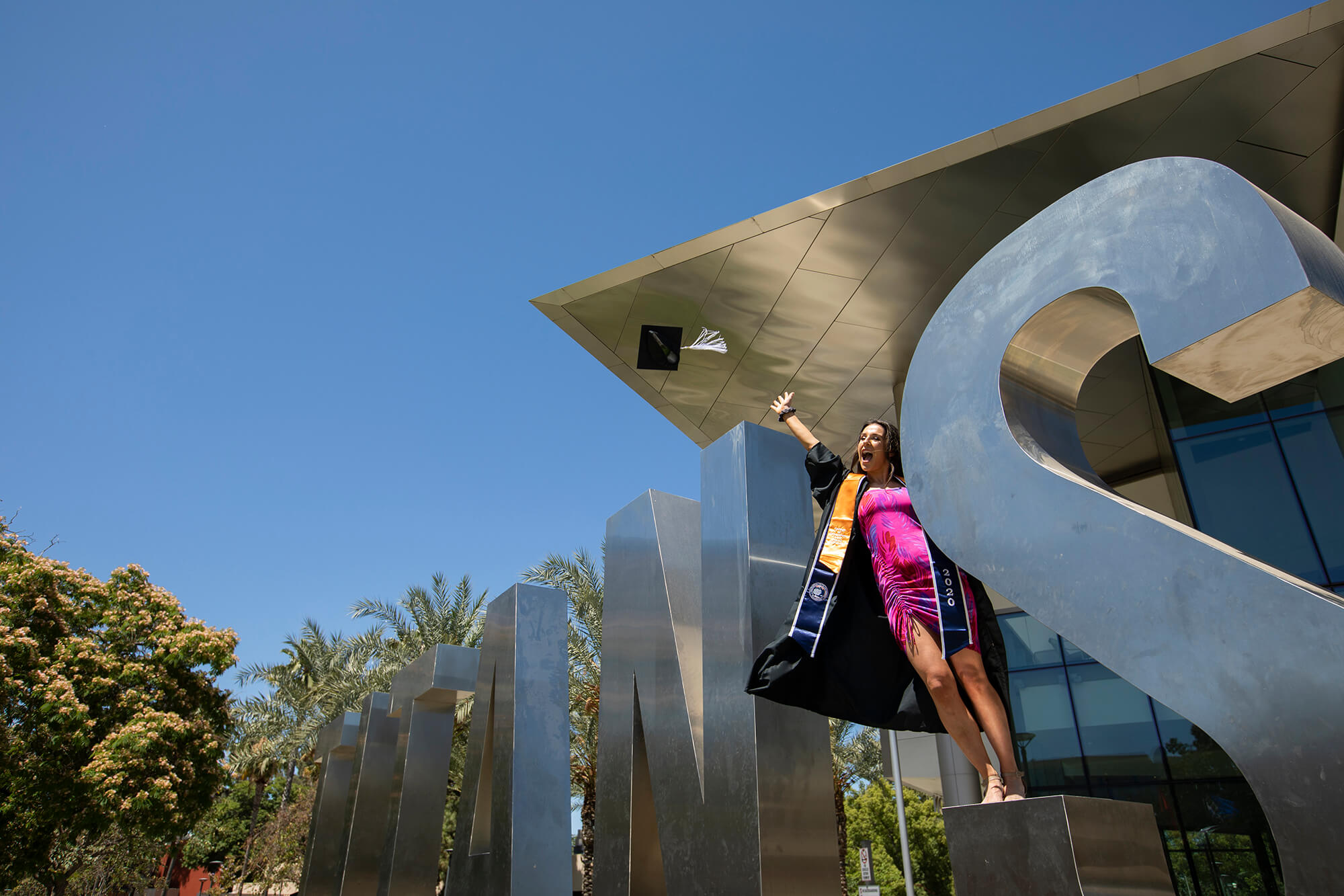 Graduate throws cap