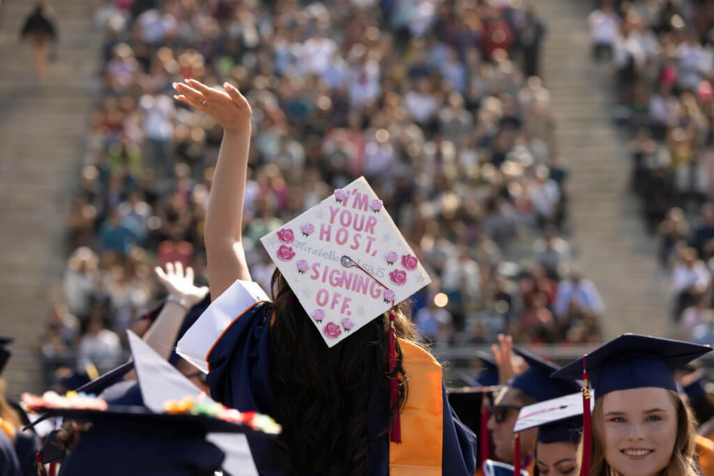 Decorated grad cap: I'm your host, signing off.