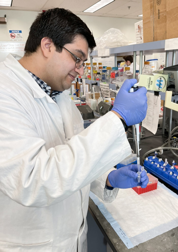 Azeem Horani works in lab