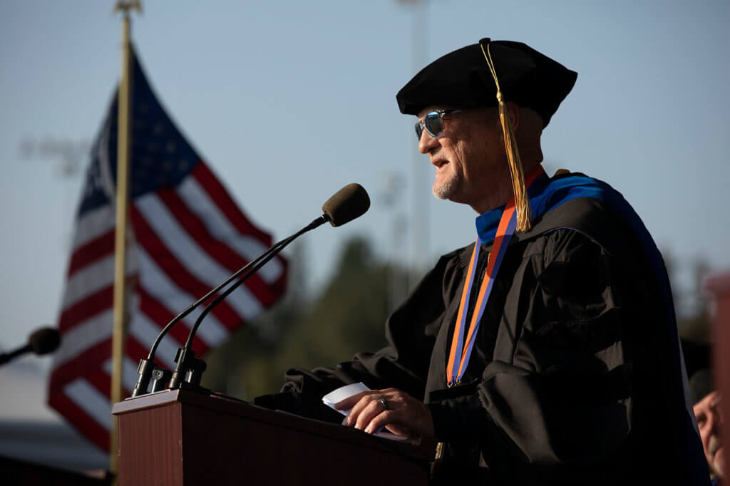 Jeff Van Harte speaks at podium