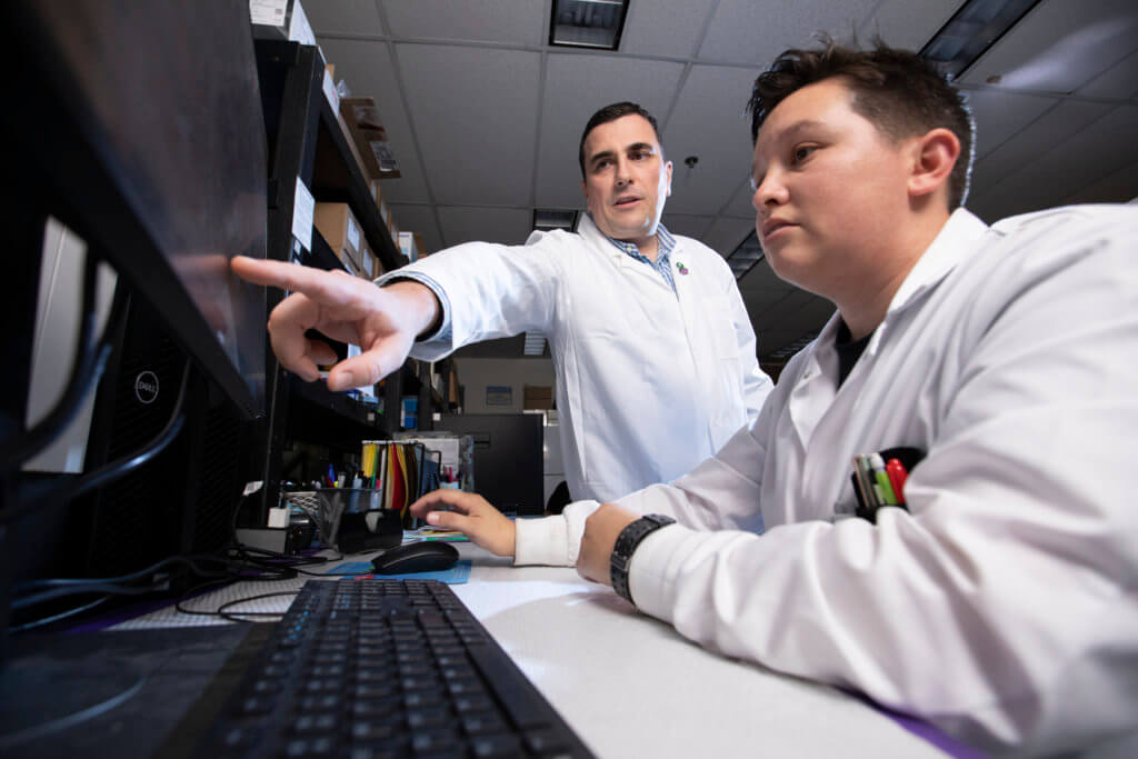 Biochemistry NSM Lab Alzheimer Researcher Stevan Pecic works with Student Ryan West