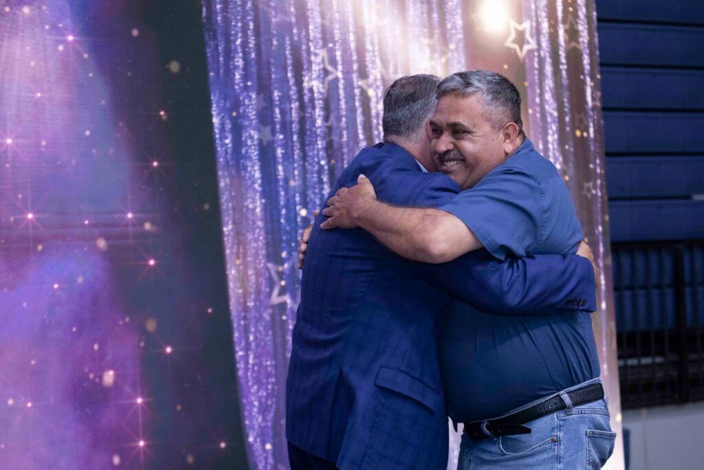 RAUL CAMACHO hugs Fram Virjee