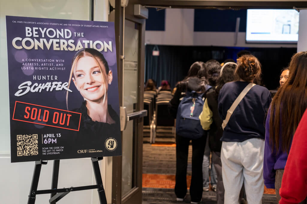 Students line up for a sold out speaking event