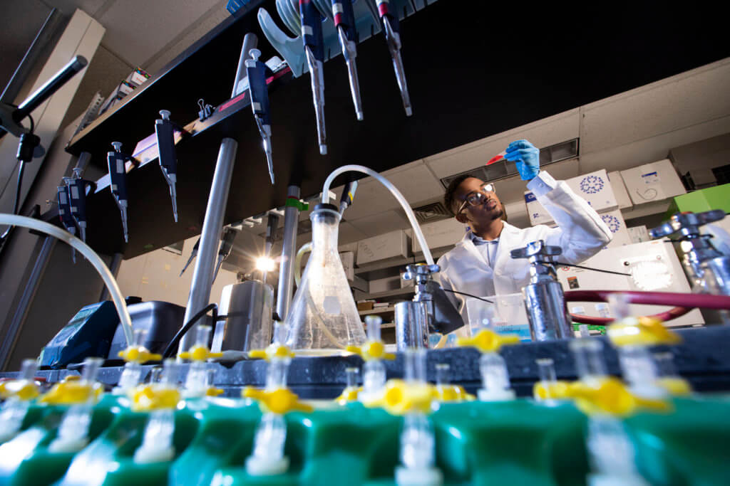 Ramadhan Ahmed working in laboratory