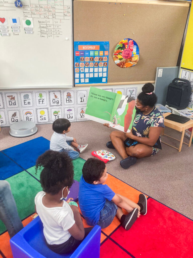 Ainara Johnson in Classroom reading to children