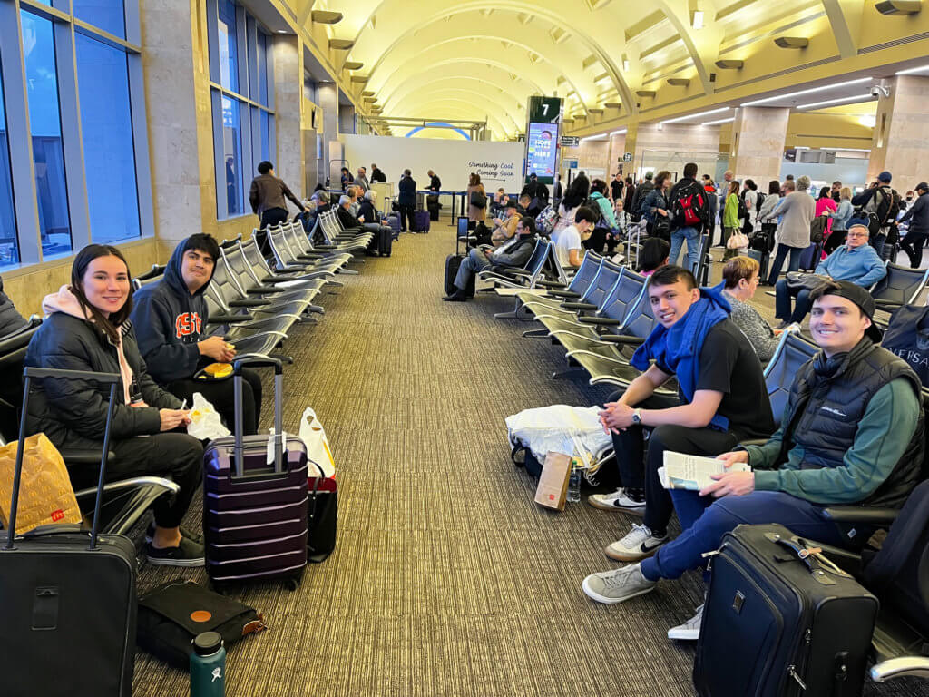 Students at airport terminal