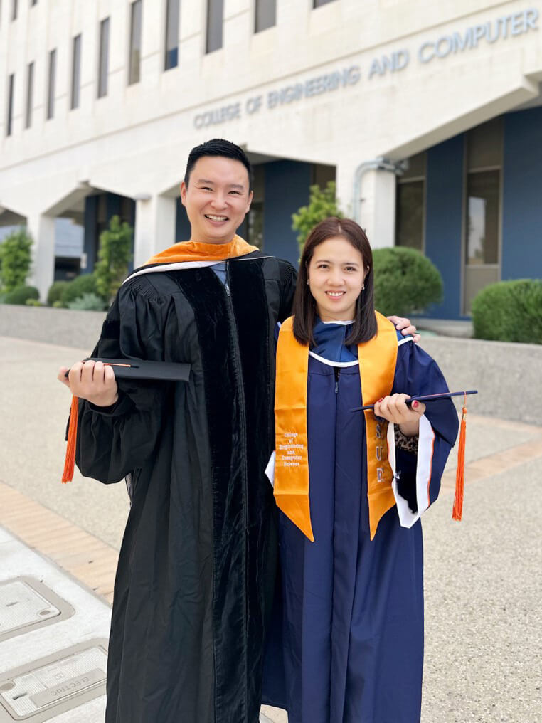 Haowei Wang and graduate Tin Luong-Uhl, who is earning a college degree in mechanical engineering