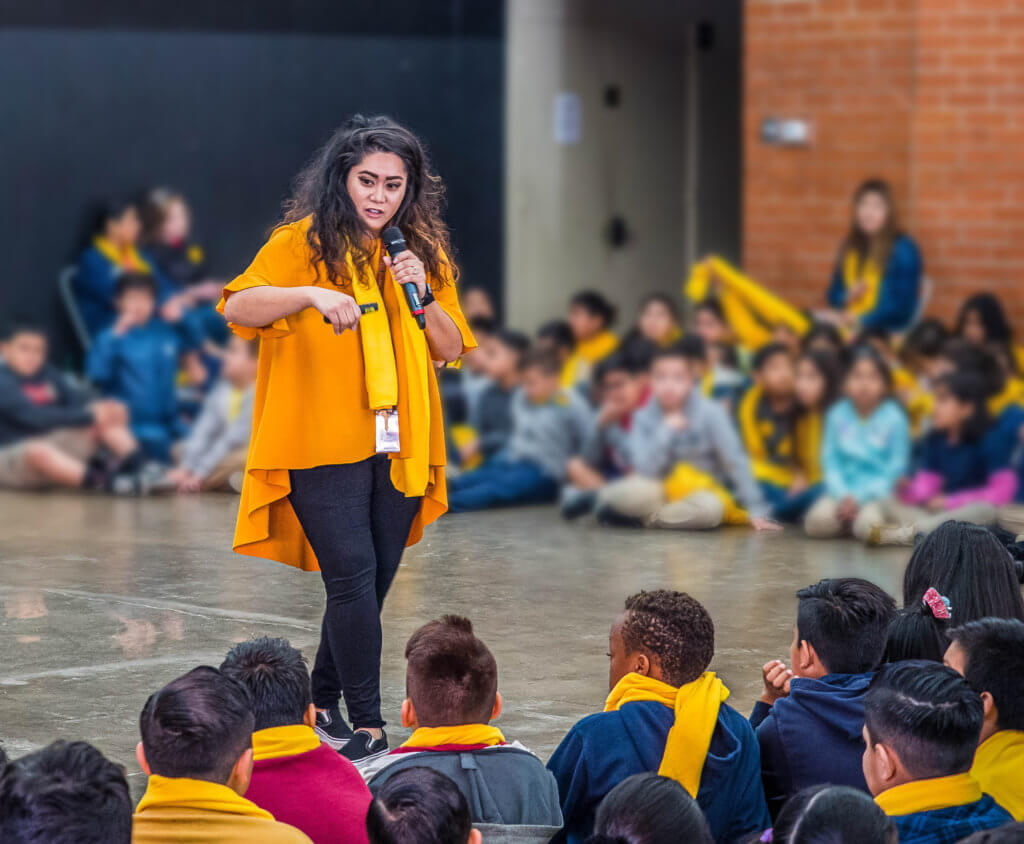 educator gilanie thomas with students