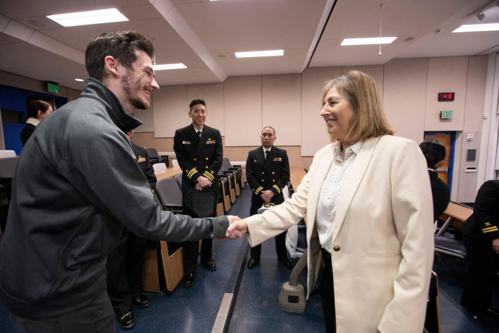 Student Nic Furtado meets Rear Admiral Pamela Schweitzer to learn about public health careers