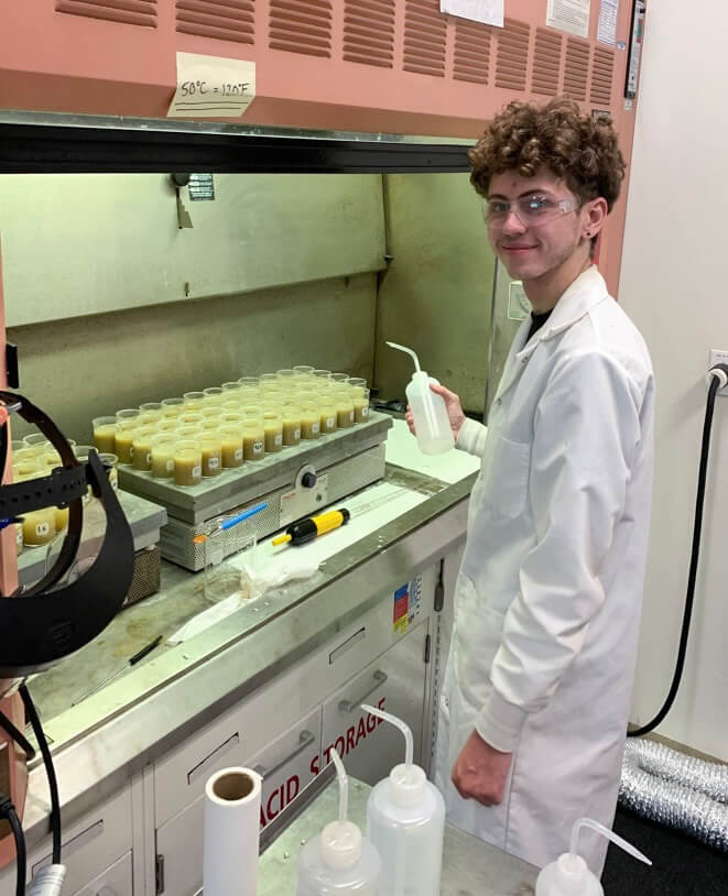 Student researcher Samuel Hippard works on flood research in lab