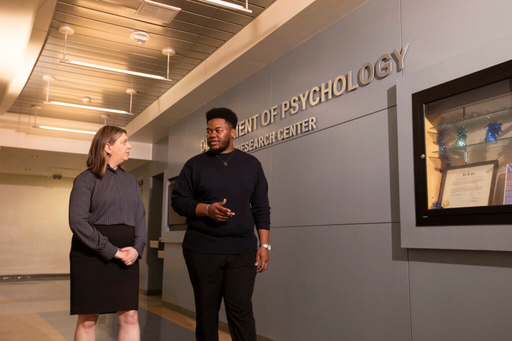 Psychology grad Joshua Bhasera and Jessie Peissig, chair and professor of psychology
