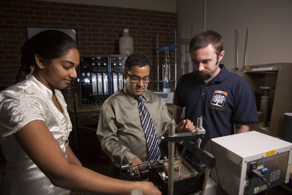 Binod Tiwari, alums Beena Ajmera and John Thurlo in the civil engineering lab