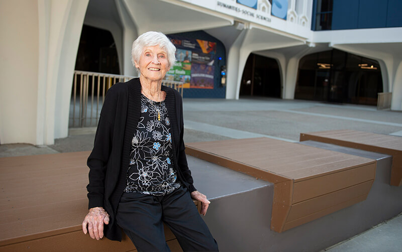 Donna Spradlin sitting outside of Humanities