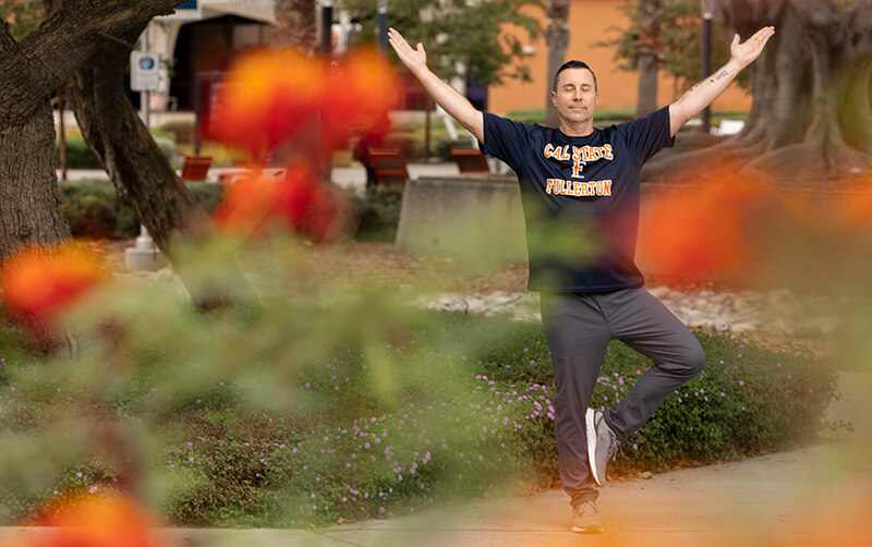 High school teacher Jason Euston doing yoga to improve teacher wellness and well-being