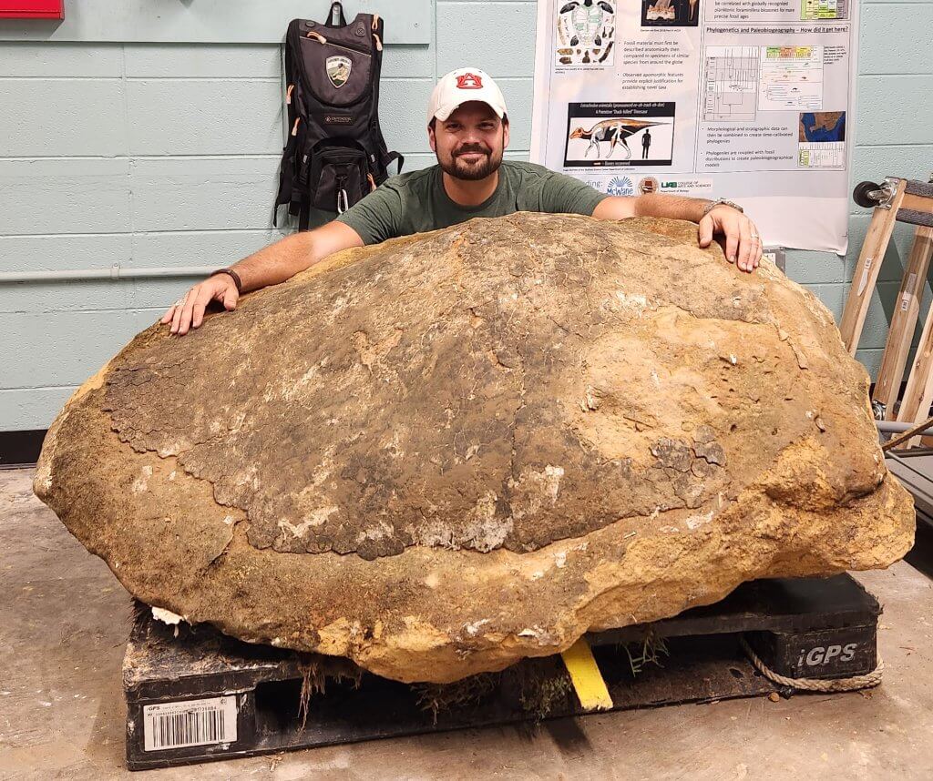Paleontologist Andrew D. Gentry with ancient sea turtle fossil