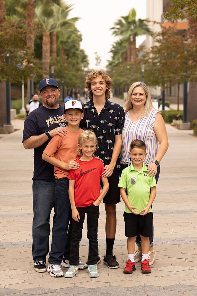 Alex Grandstaff, center, poses for a photo with his family.