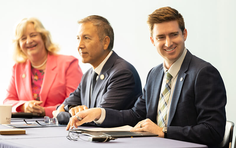 Connor Traut with supervisors on panel