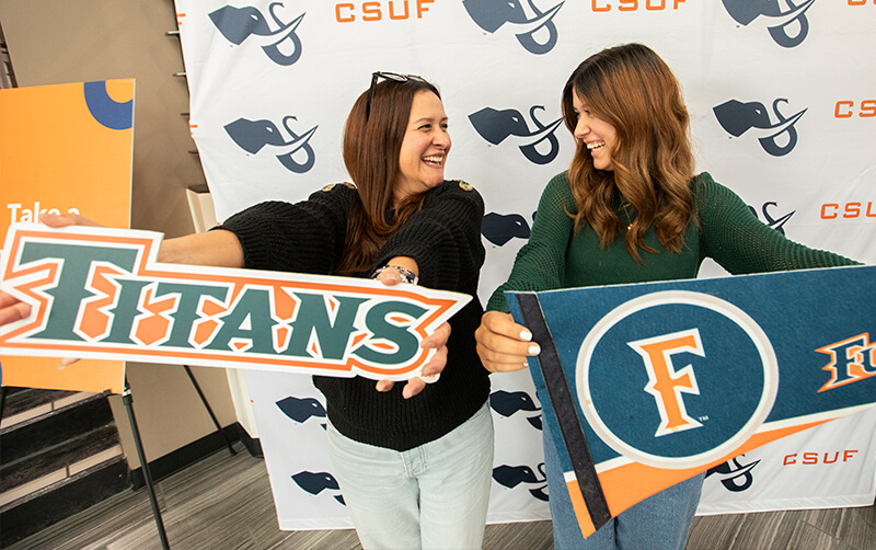 Incoming student Reme Bradley celebrates her acceptance to Cal State Fullerton with her mother.