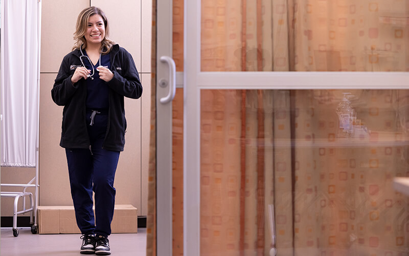 Sophia Santana stands in the Nursing Simulation Center at Cal State Fullerton.