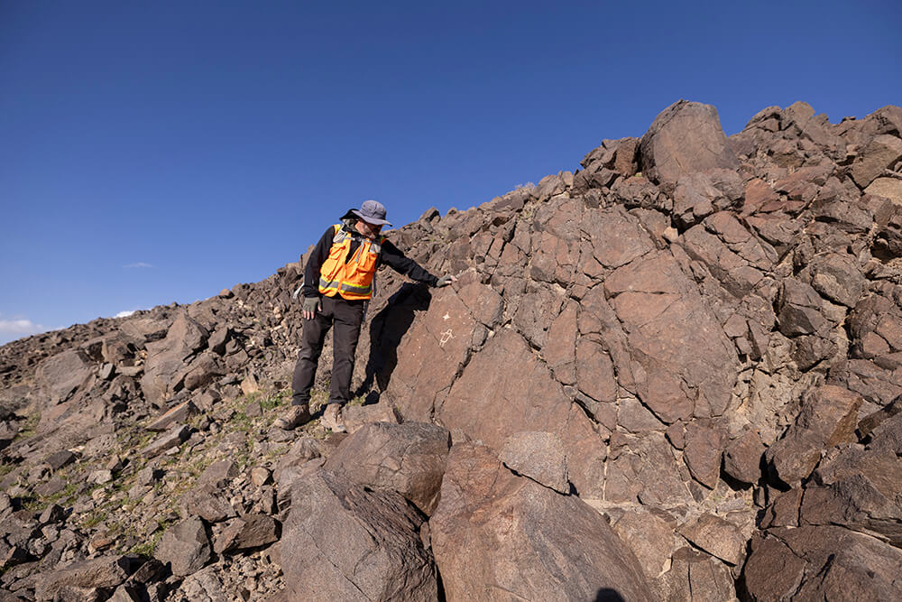 Kirby on Rocks with Petroglyph to investigate impact of climate change