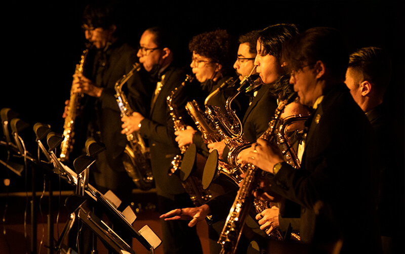 Student jazz group performs on stage. 