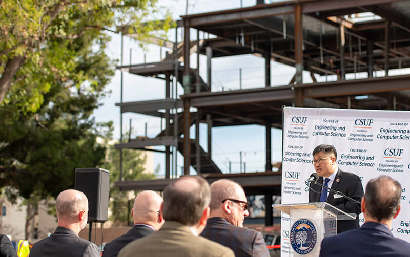 College of Engineering and Computer Science Dean Sang June Oh speaks at ECS Innovation Hub construction site