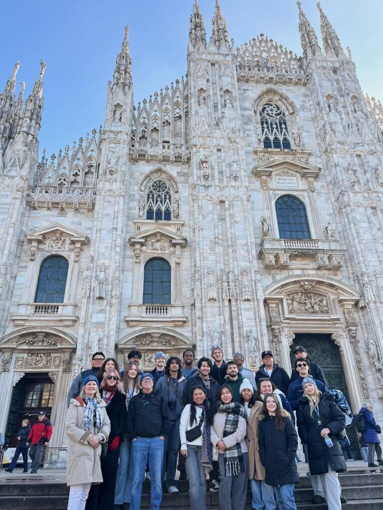 Cal State Fullerton students stand in front of a cathedral in Milan.