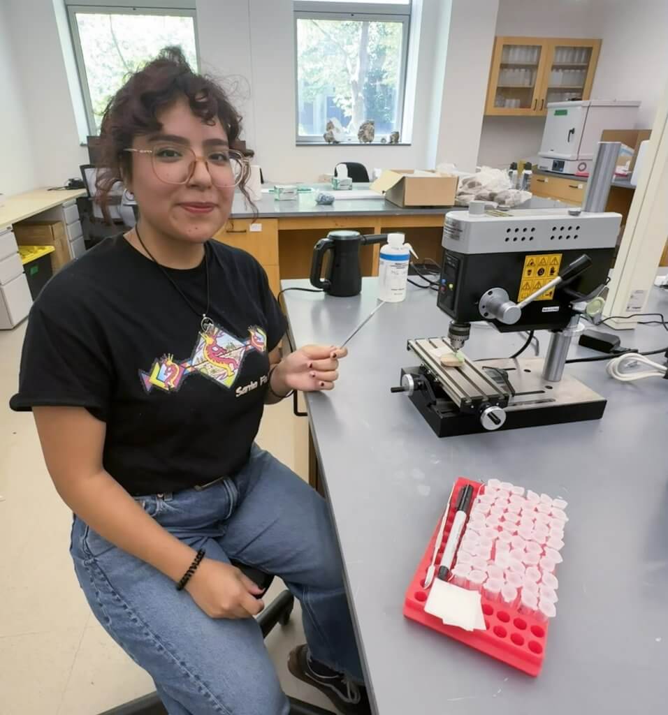 student Yelitza Cabrera works on climate research in lab