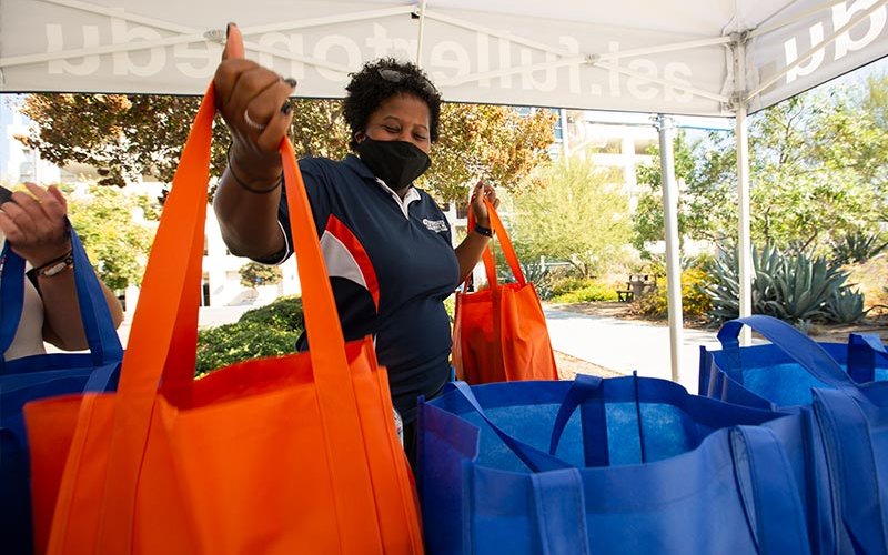 Asha Nettles distributes food.