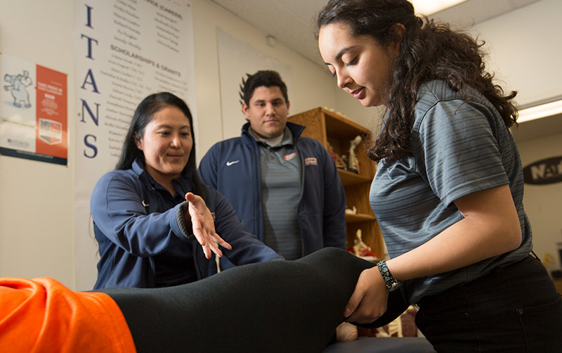 Athletic Trainers work on a patient.