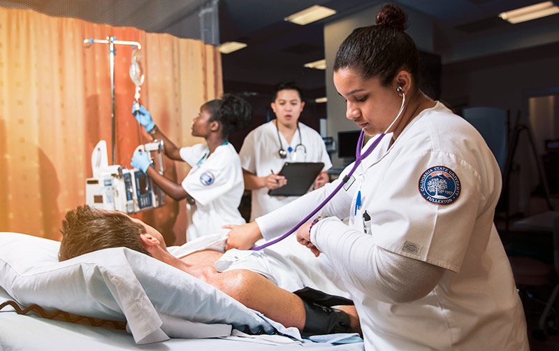 Nursing students in simulation lab.