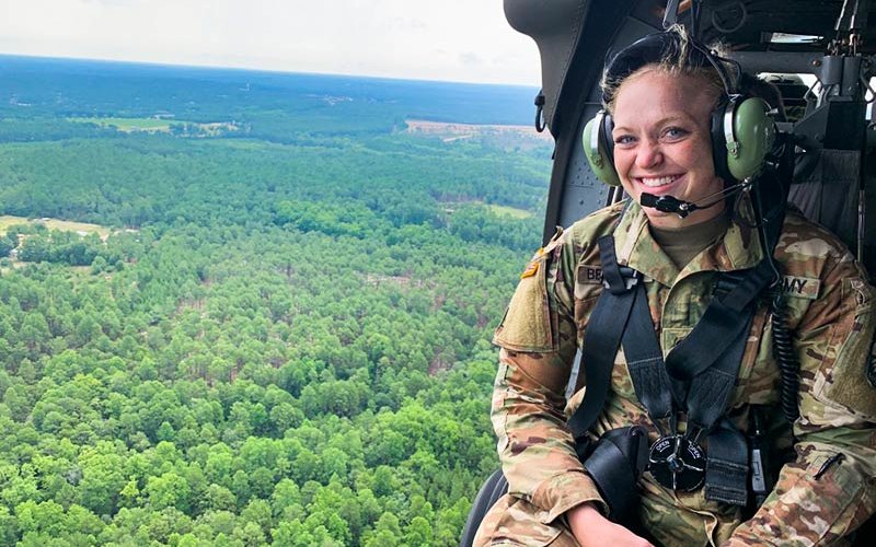 Sara Berlinger in a helicopter