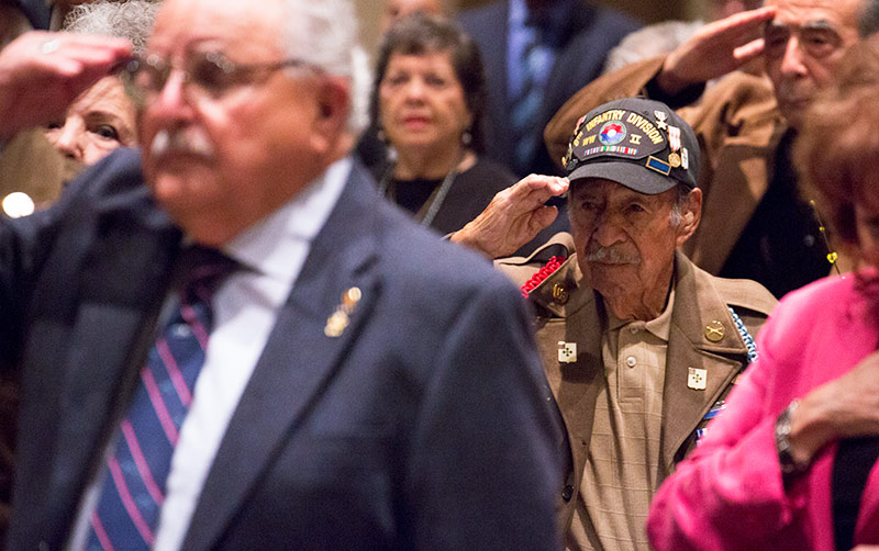 Veterans saluting.