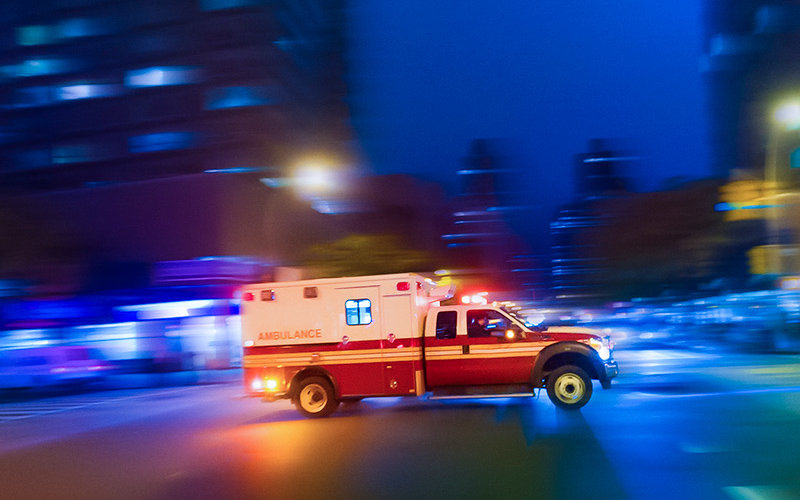 Ambulance speeding at night on an urgent call