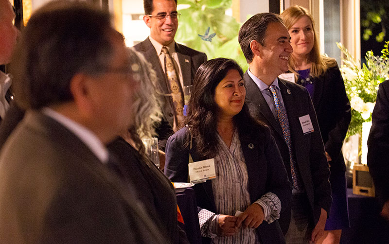 Farrah Khan from the City of Irvine listens to Fram Virjee.
