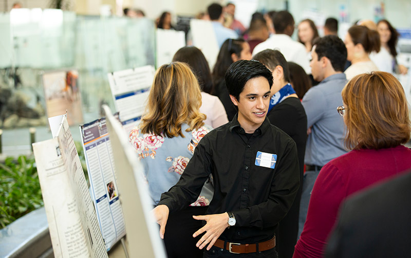 Darnell Calderon presents his research.