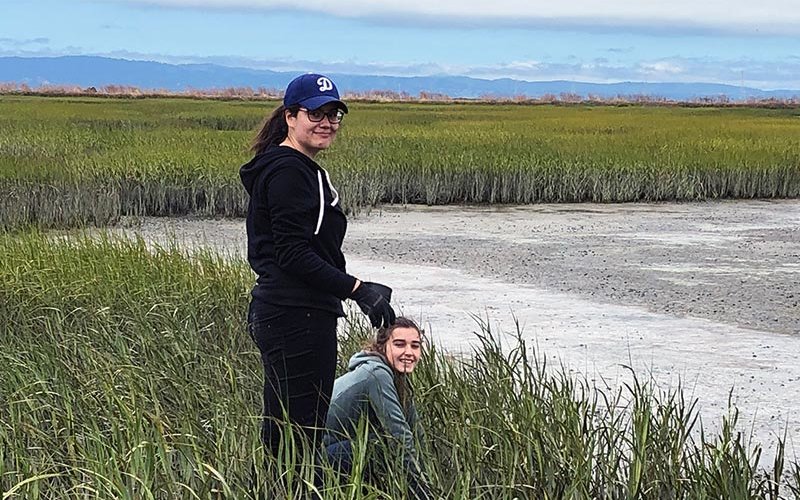 Duncan researching in wetland.