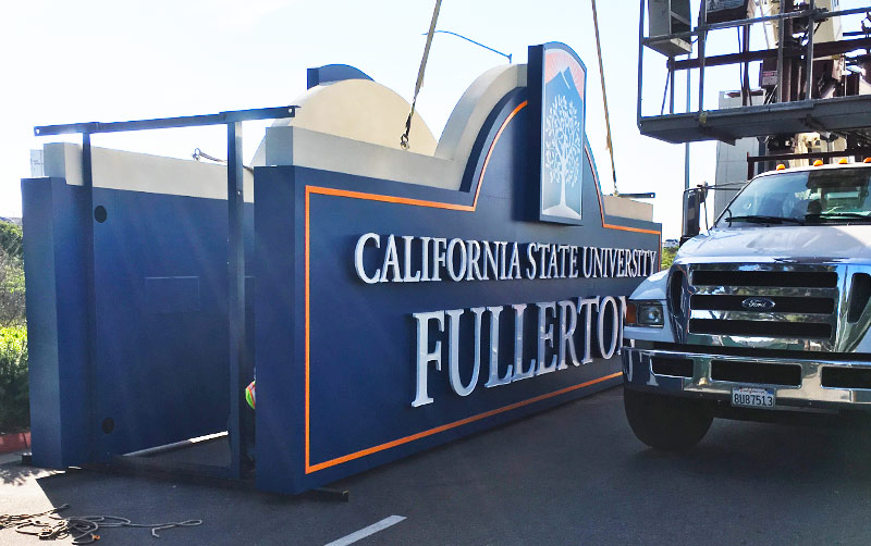 Freeway sign being prepared to be installed.