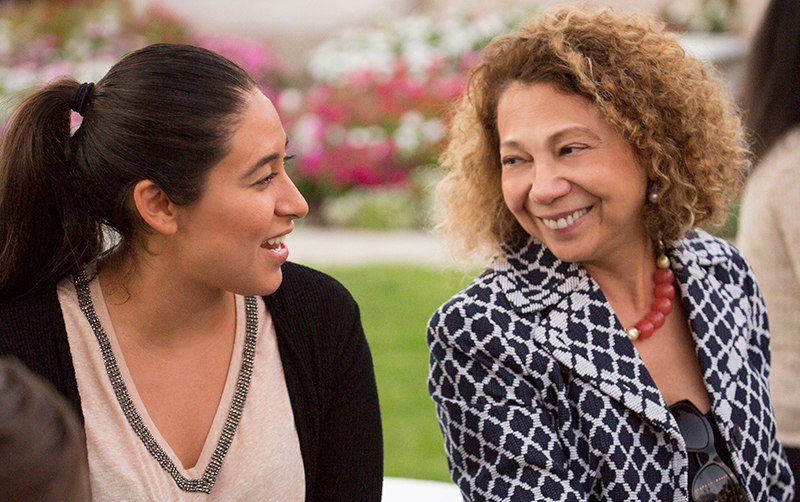 President Mildred Garcia with student Arisai Huidobro