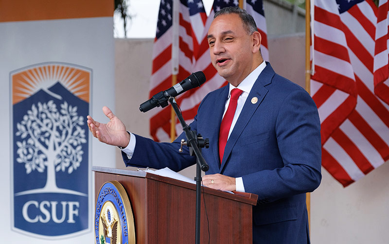 Gil Cisneros being sworn in