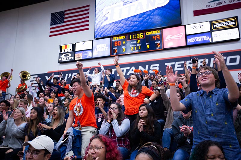 Titans cheering from bleachers during Homecoming 2018