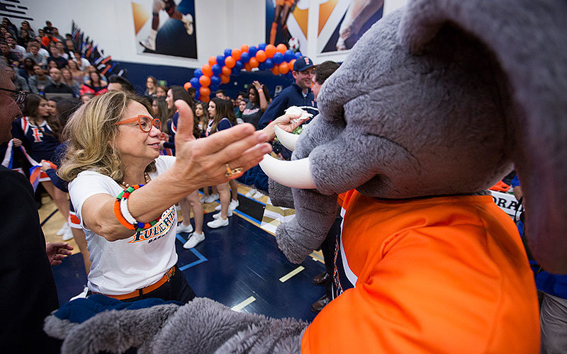 President Mildred Garcia greeting Tuffy at Homecoming.