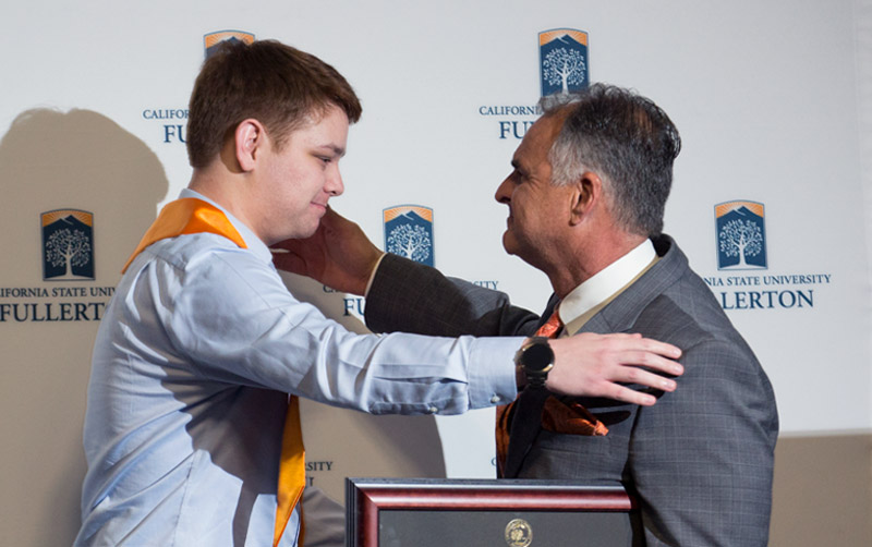 Guardian Scholar Jacob Biloki and CSUF President Framroze Virjee