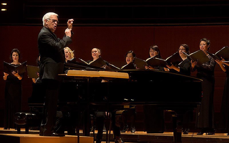 Conductor John Alexander leads a performance with the University Singers.